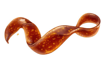 Obraz premium Swirling liquid amber ribbon on transparent background close-up view.