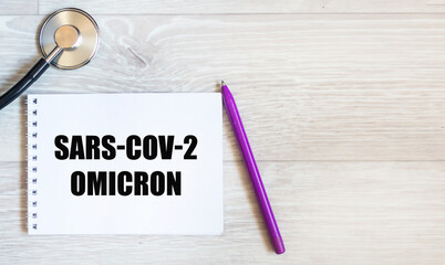 Omicron SARS-CoV-2 .There is an Omicron SARS-CoV-2 entry on a white background on the notebook. The...
