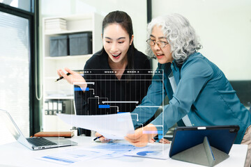 Project manager working and update tasks with milestones progress planning and Gantt chart scheduling diagram.business tram working at office