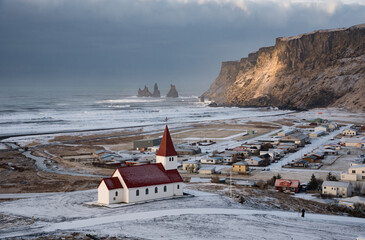 Icelandic village of Vik, with the Myrdal church at the top of the hill. Iceland Europe