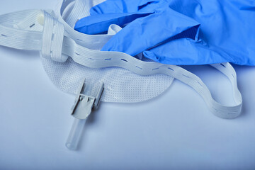 urine collection bag with fasteners and rubber gloves