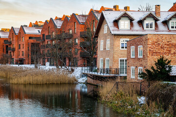New block houses construction. New brick houses on the river embankment