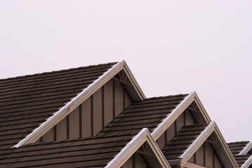 Brown wooden roof shingles © Conrmiller