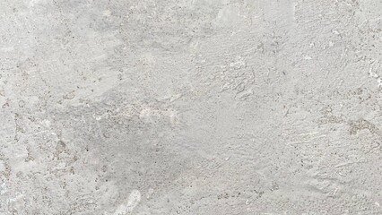 Obraz premium The texture of the gray cement wall with a rough and natural surface, displays a minimalist feel.