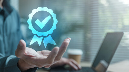 quality, assurance, certification, compliance, approval, A digital quality badge with a check mark floating above a person’s hand, symbolizing certification, assurance, and performance approval.