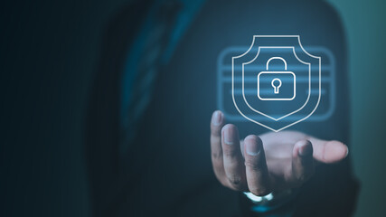 A digital security concept showing a hand with a holographic shield and lock icon, representing credit card freeze, fraud prevention, secure payments, identity protection and financial safety systems.