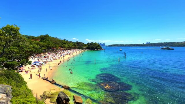 Shark Beach Nelson Park Beach in Sydney Eastern Suburbs on Sydney harbour with turquoise Blue waters white sandy Beach on a warm summer day blue skies Sydney NSW Australia