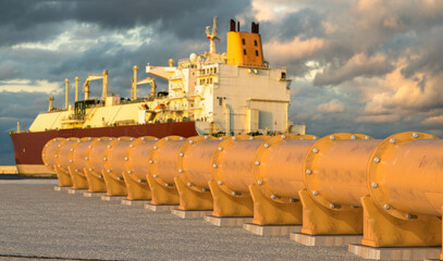 Pipelines leading the LNG terminal and the LNG tanker.3D rendering.