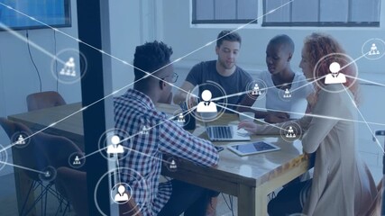 Animation of network of connections with people icons over diverse business people in office - Powered by Adobe