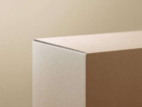 Close up of neutral cardboard box corner with soft light showing texture and layers in minimal style