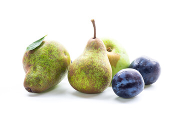 Autumn harvest of ripe pears and blue plums © Peredniankina