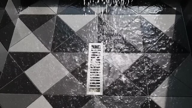 Mesmerizing Cascade Captivating Water Flowing On The Geometric Stone Surface For Modern