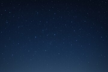 Fototapeta premium Starry night sky landscape with countless bright stars scattered across dark blue space, symbolizing cosmic wonder and infinity concept. Ai generative
