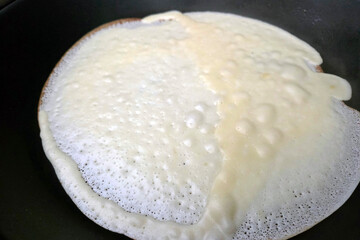 Close-Up of Crepe Cooking in a Non-Stick Pan - Breakfast Cooking Concept