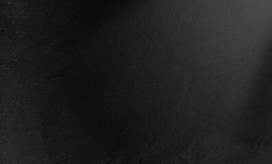 Dark cement wall background with grainy light leak flare overlay