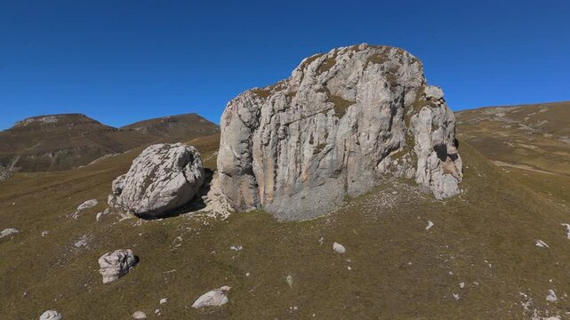 Dramatic Pull Back Aerial from Baba Mare Rocks to Salvamont Cabin and Costila Relay 4K