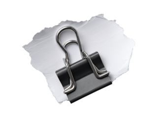 Black binder clip on torn paper isolated on transparent or white background, png