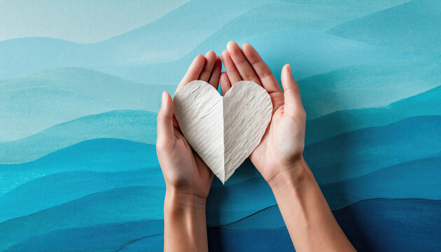 Mental health awareness concept hand paper heart human hand blue background ocean wave hope support empathy care wellness mental health awareness peace serenity calm kindness healing therapy