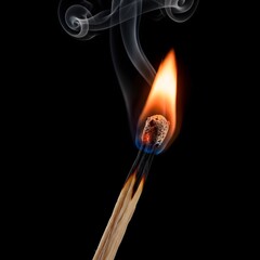 Close up studio photograph of a single wooden matchstick burning brightly with curling wisps of white smoke against a stark black background in isolation.