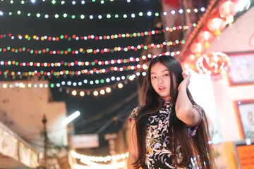 Vibrant New Year Celebration with Young Girl in Festive Lights