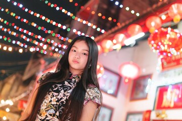 Young Girl Dressed in Traditional Outfit Celebrating New Year Festivities