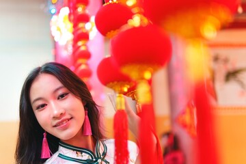 Young Girl Celebrating New Year with Lanterns and Decorations