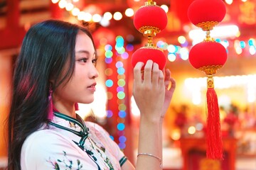 Young Girl Admiring Red Lanterns During New Year Celebration