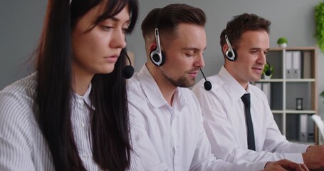 Three callcenter agents in an office wear headsets, providing customer support with communication, teamwork, and hotline assistance. Focused team delivering reliable service for customers. - Powered by Adobe