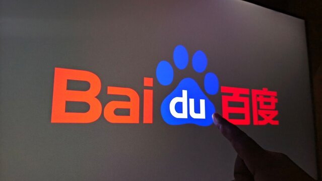 Baidu logo on screen with hand touching it