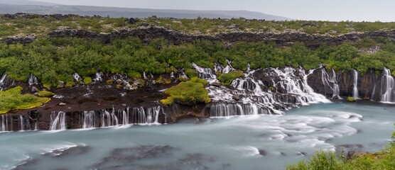 panoramic view of the picturesque Hraunfossar cascades in western Iceland