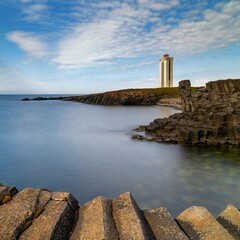 view of the basalt columns and lighthouse of Kalfshamarsvik in northern Iceland