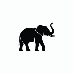 Obraz premium Elegant Silhouette of an Elephant with Trunk Raised.