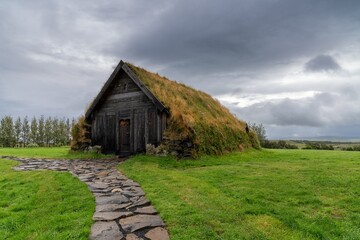 view of the Porlaksbud turf house next to the Skalholt Cathedral in southwestern Iceland