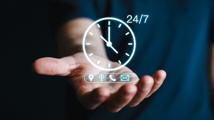 A person holding a glowing white 247 clock icon in their hand with communication symbols on a dark blue background representing customer service