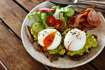 traditional breakfast with fried egg and salad