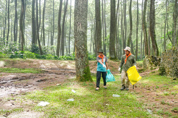Dedicated Volunteers Collect Litter in Serene Forest