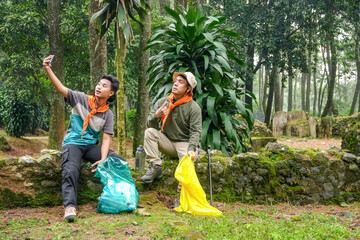 Adventurous Friends Documenting Their Forest Exploration Trip