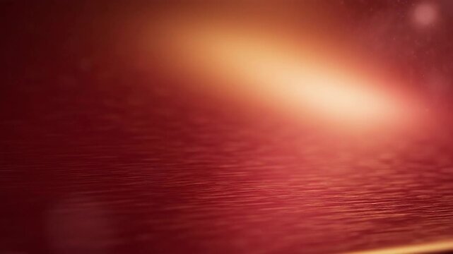 Abstract red and gold background with subtle texture and light effects