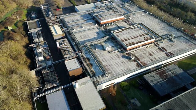 High altitude drone footage of Milton Keynes data center showing cloud storage, quantum computing systems, and server infrastructure