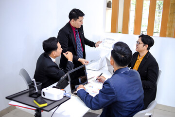 Professionals Engaged In Strategic Meeting At Modern Office