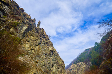 Mountain landscape in the Carpathian Mountains, Romania, Mehedinți, on a snowless winter day.