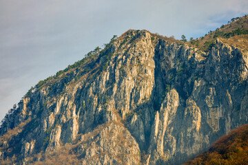 Mountain landscape in the Carpathian Mountains, Romania, Mehedinți, on a snowless winter day.