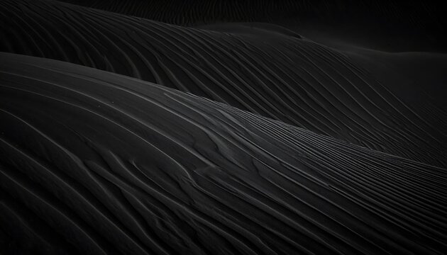 Abstract, dark, textured landscape resembling black sand dunes with flowing, parallel lines and subtle gradients