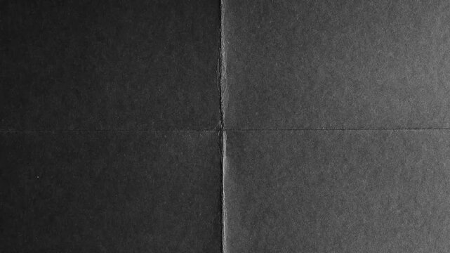 Black Paper Folded in Four Sections with Subtle Texture