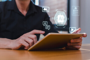 Businessman using AI technology on digital tablet for data analysis, automation, and content creation. Artificial intelligence in business tech innovation concept.