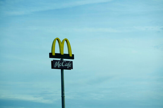 Gorzow Wielkopolski, Poland 11.01.2025 A McCafe sign against a cloudy sky.