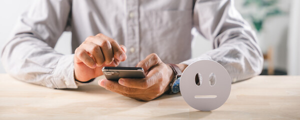 Neutral customer feedback icon symbolizes service quality assessment, person using smartphone provides online satisfaction survey rating for client experience evaluation