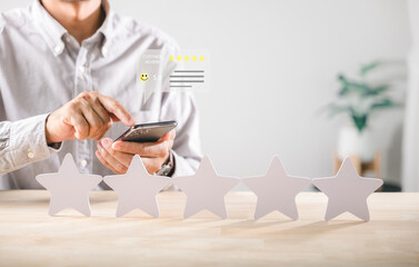 Customer gives online review for product experience providing five star satisfaction rating using mobile phone app delivering important feedback for quality service improvement survey
