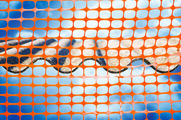 OLD AGED DANGEROUS ASBESTOS ROOF in a construction site with safety plastic orange grid
