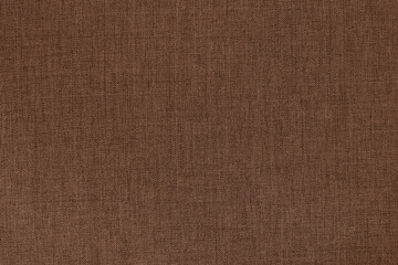 Fototapeta premium Dark brown linen fabric cloth texture for background, natural textile pattern.